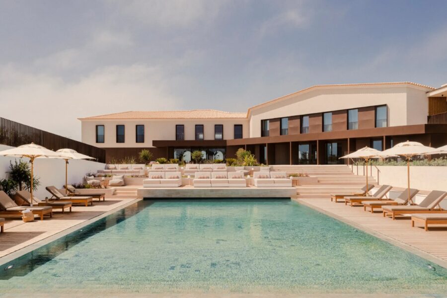 Infinity pool with shaded lounge chairs