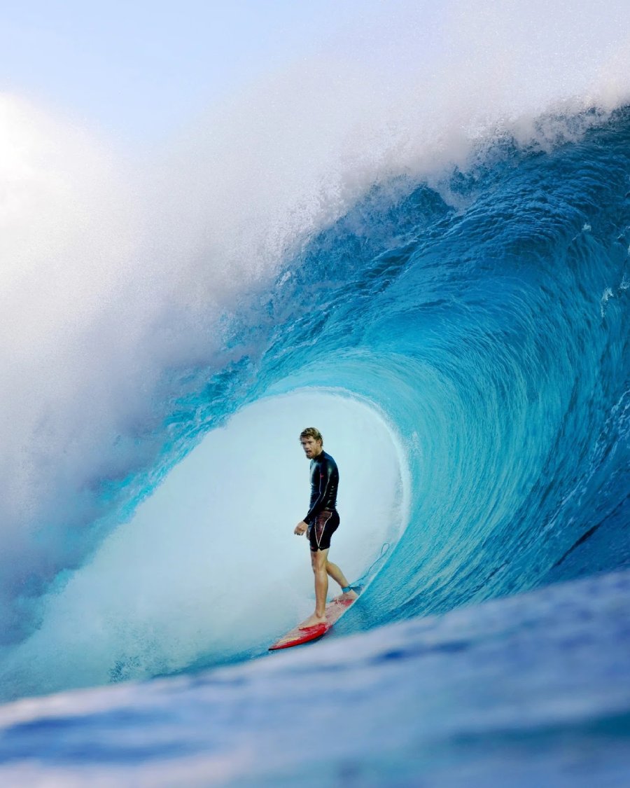 man surfing in surf shorts