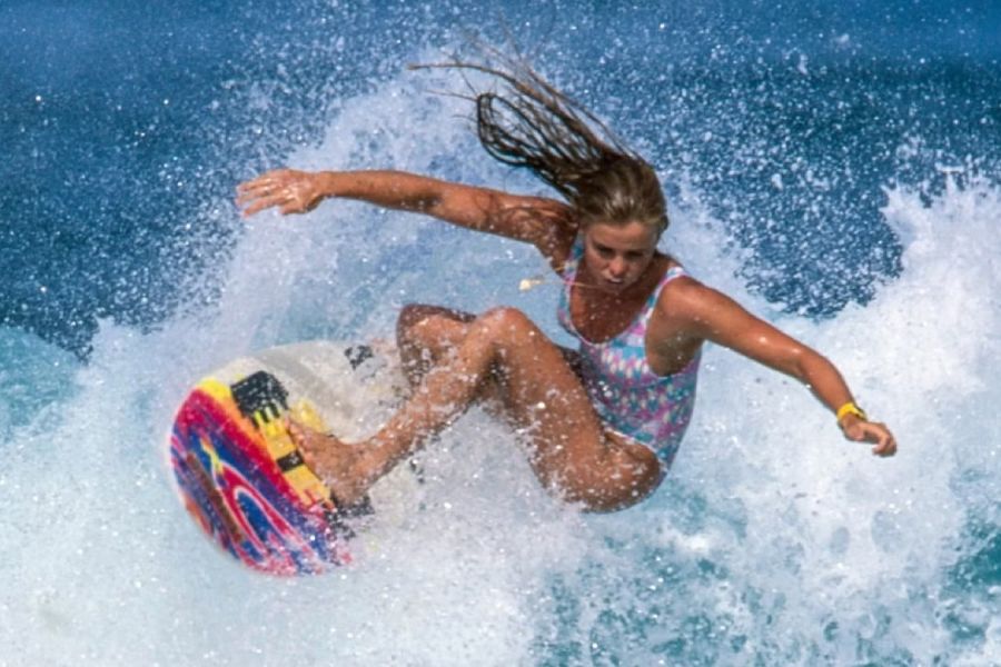 girl surfing in surf movie