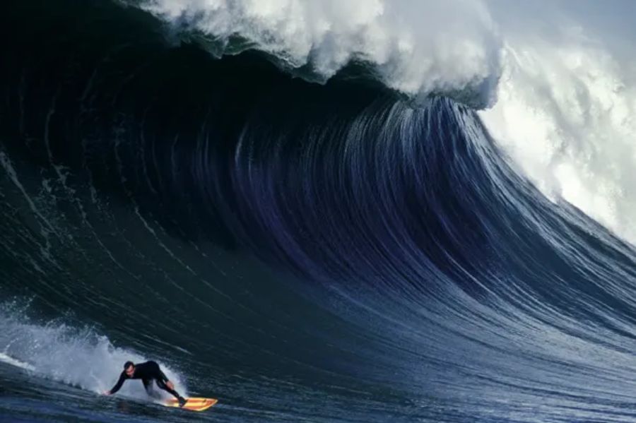 guy surfing on big wave