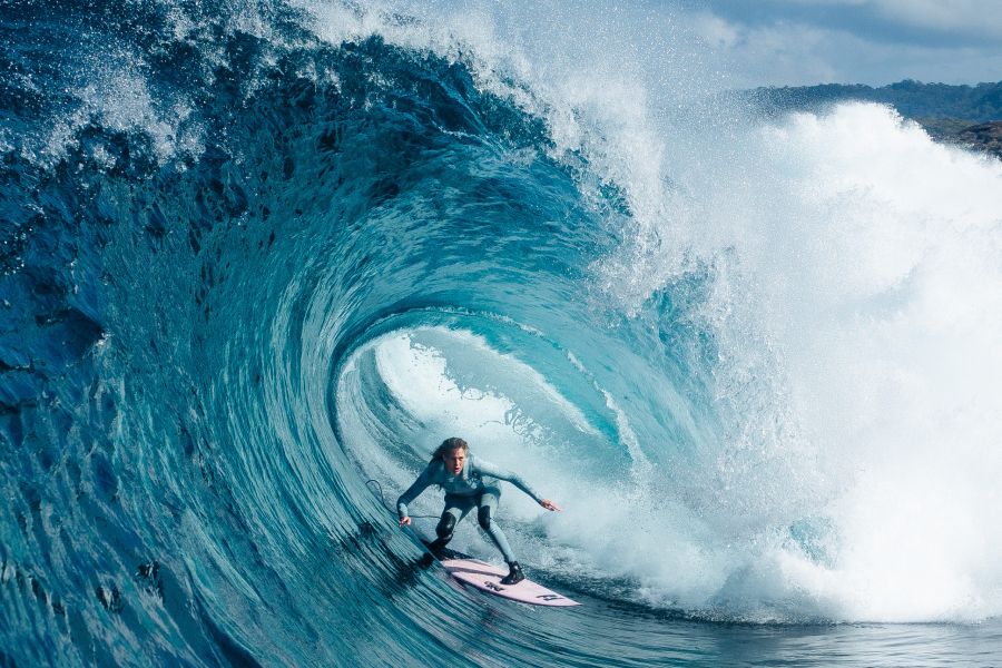 woman surfing on big wave