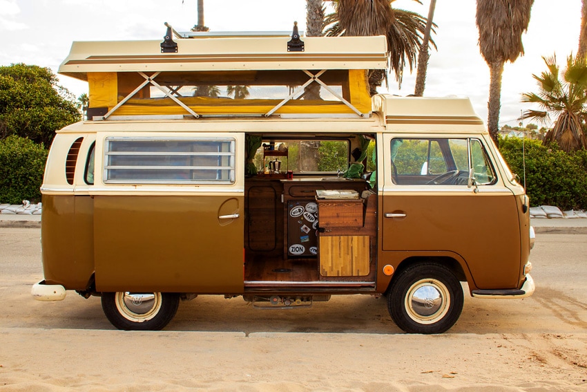sunset view of escape camper with palm trees