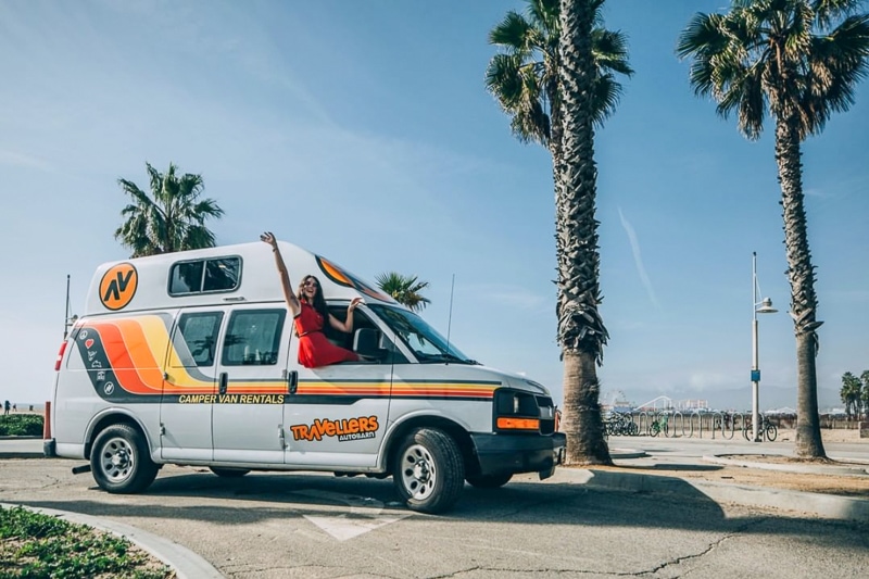 camper among California palm trees