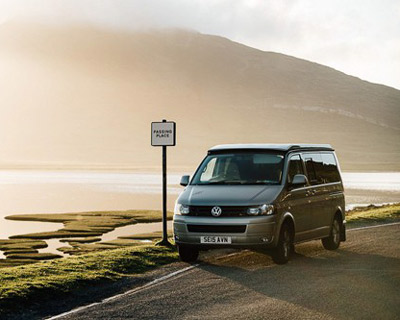 vw van with picturesque mountain lake scenery