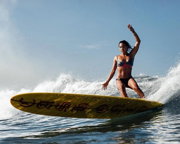 longboard surfer cutback