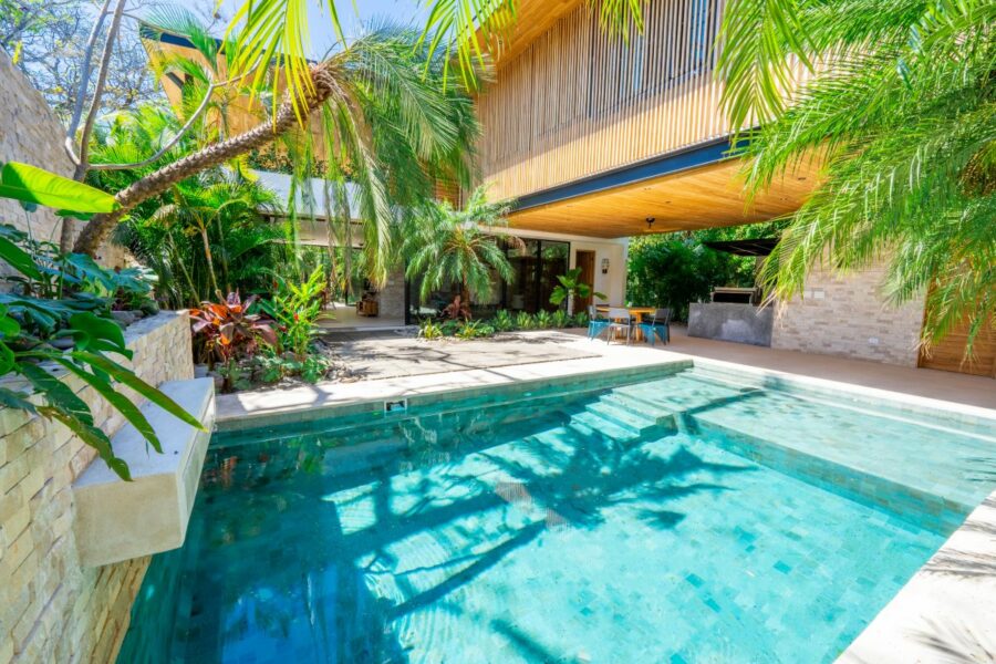 modern surf house with tropical pool