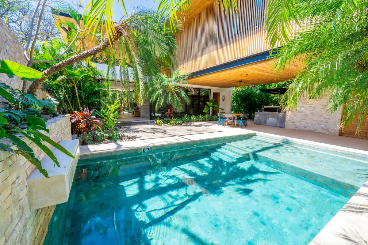 modern surf house with tropical pool