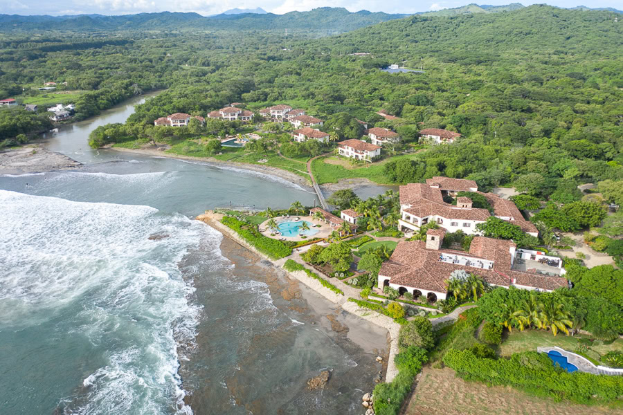 Rancho Santana aerial view with ocean, villas, and pool