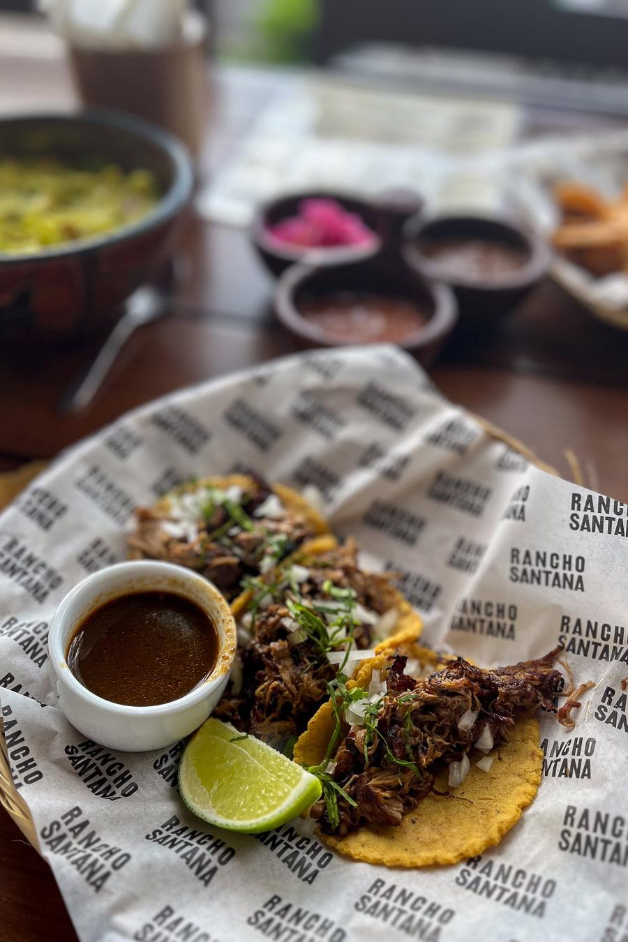 Delicious tacos served with lime and dipping sauce
