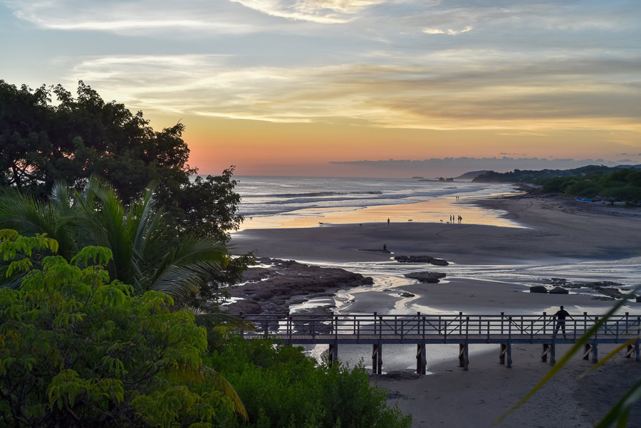 Sunset over Rancho Santana beach and boardwalk