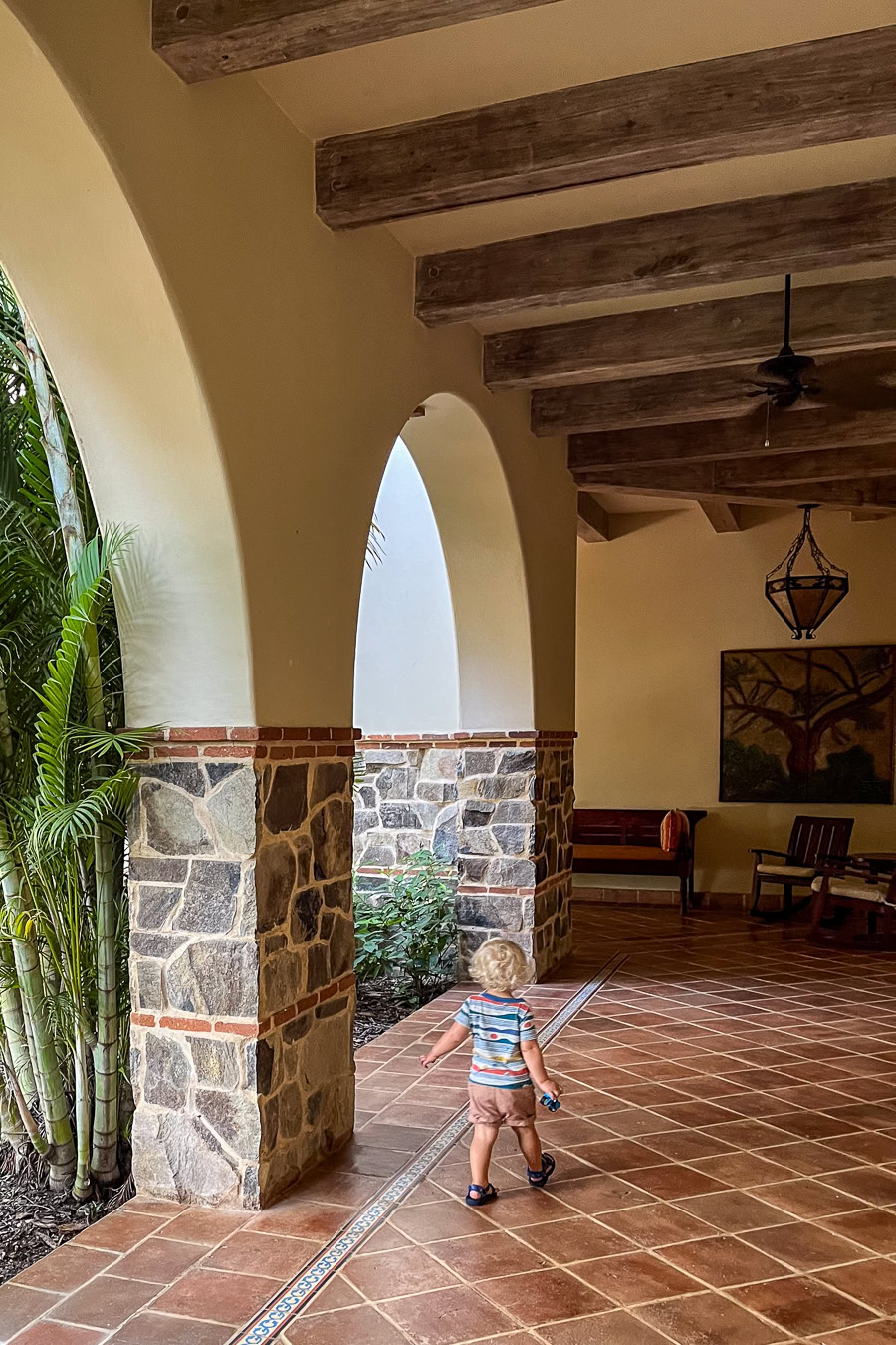 Child walking through Rancho Santana’s corridor