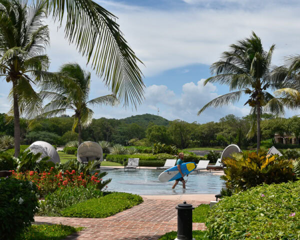 surfer by the pool at Rancho Santana, Nicaragua