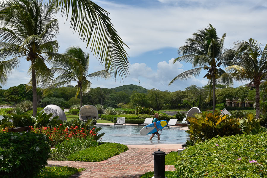 surfer by the pool at Rancho Santana, Nicaragua