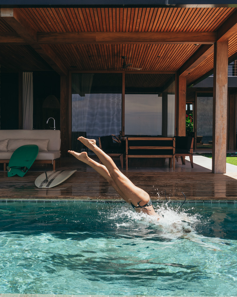 girl diving into pool