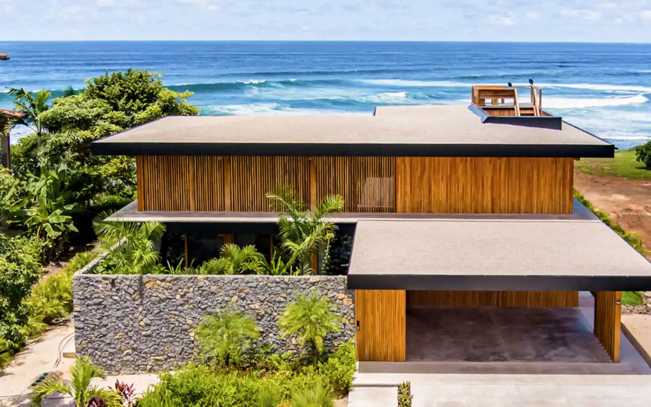 arial drone shot of luxe oceanfront villa