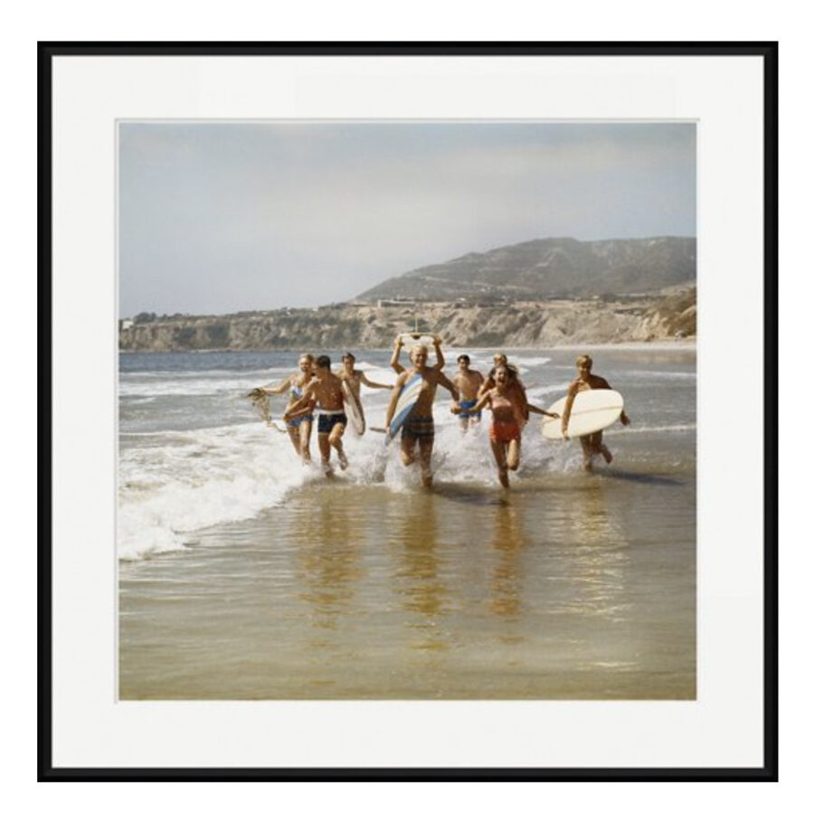 Vintage surf photography print of people running on the beach with surfboards