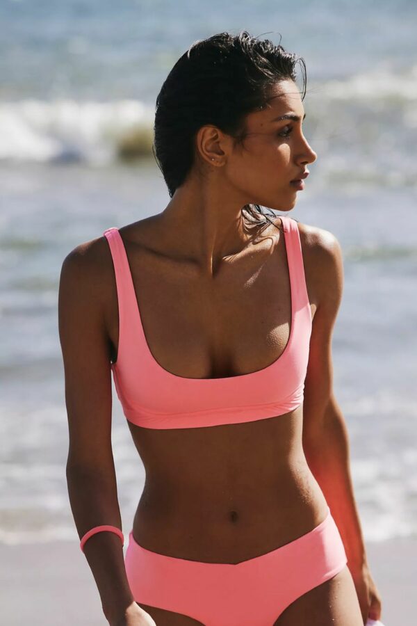 woman wearing pink surf bikini