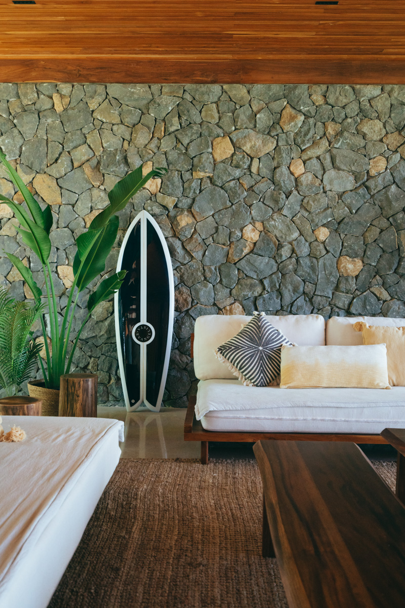 surfboard in living room at luxe villa