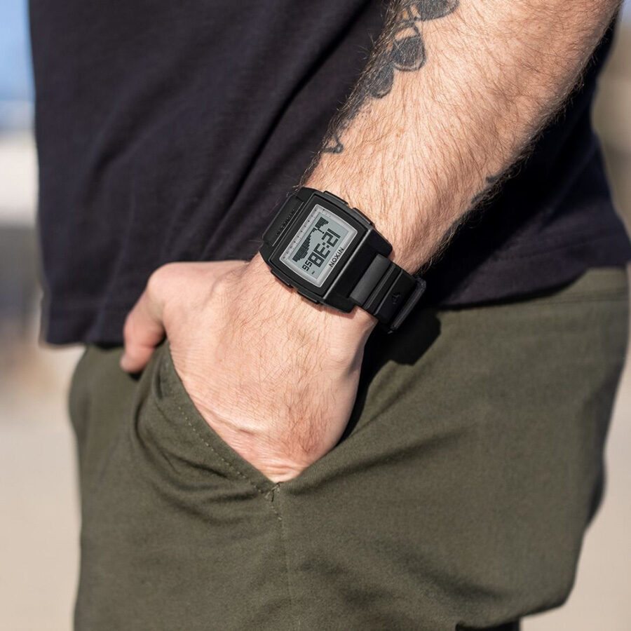 Surfer wearing Nixon surf watch