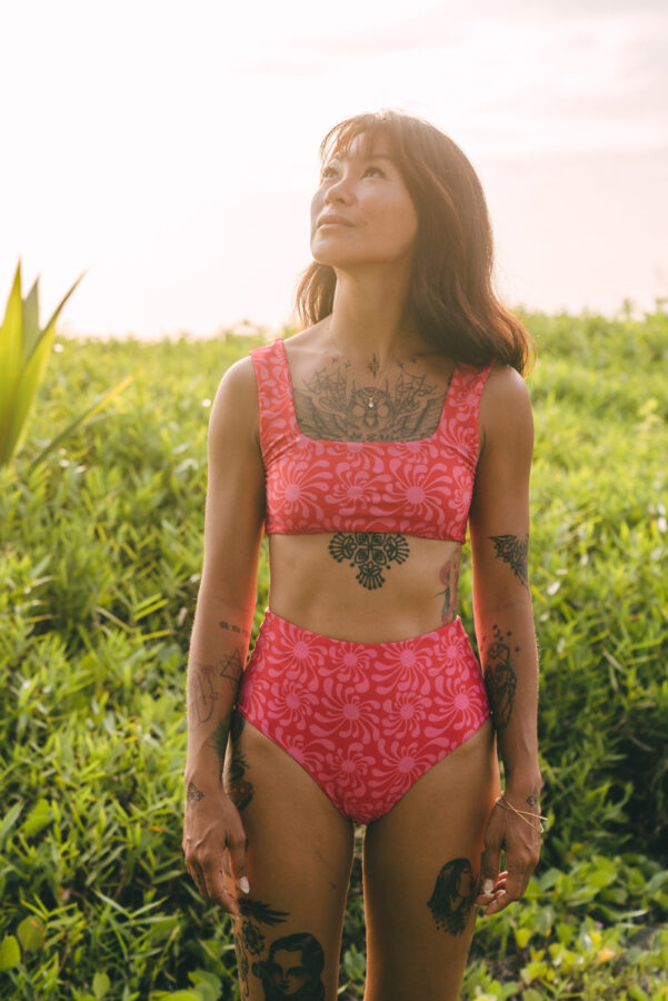 woman in bikini / sustainable swimwear for surfing
