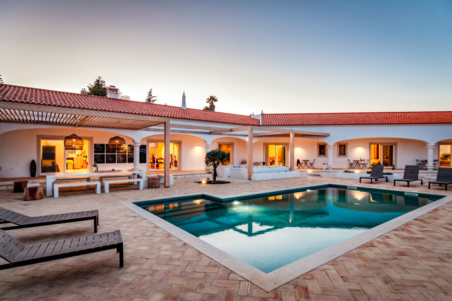 Pool and outdoor area at Tiny Whale Surf Camp in Lagos, Portugal.