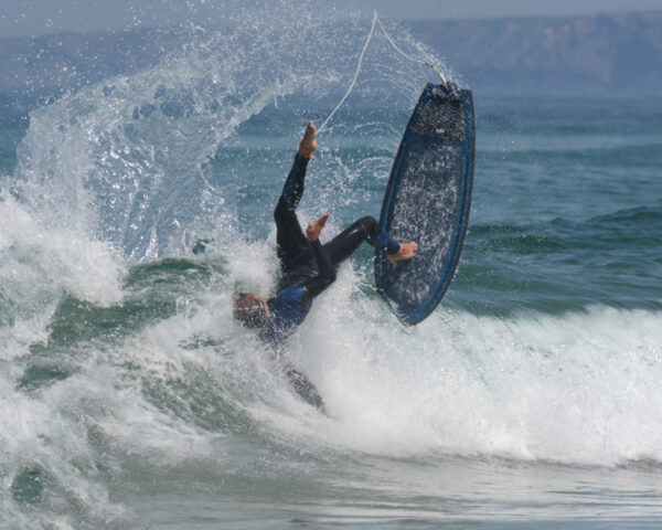 what is a kook; surfer falling off surfboard